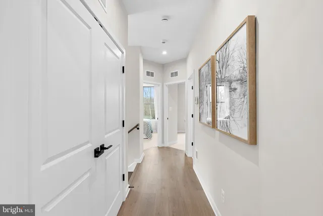 a room with a chair and a book shelf