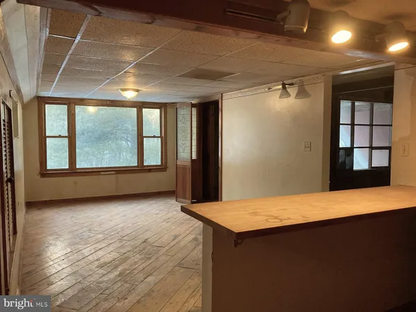 a view of an empty room with a window