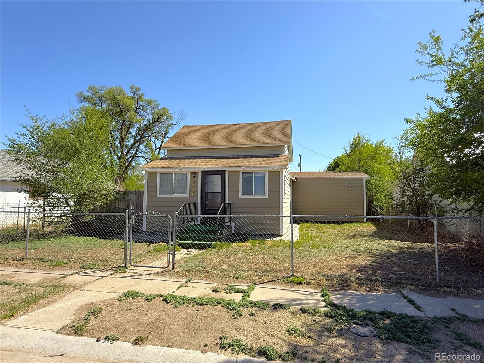 426 3rd Street Hugo, CO 80821 - Photo 1 of 34 a view of a house with backyard