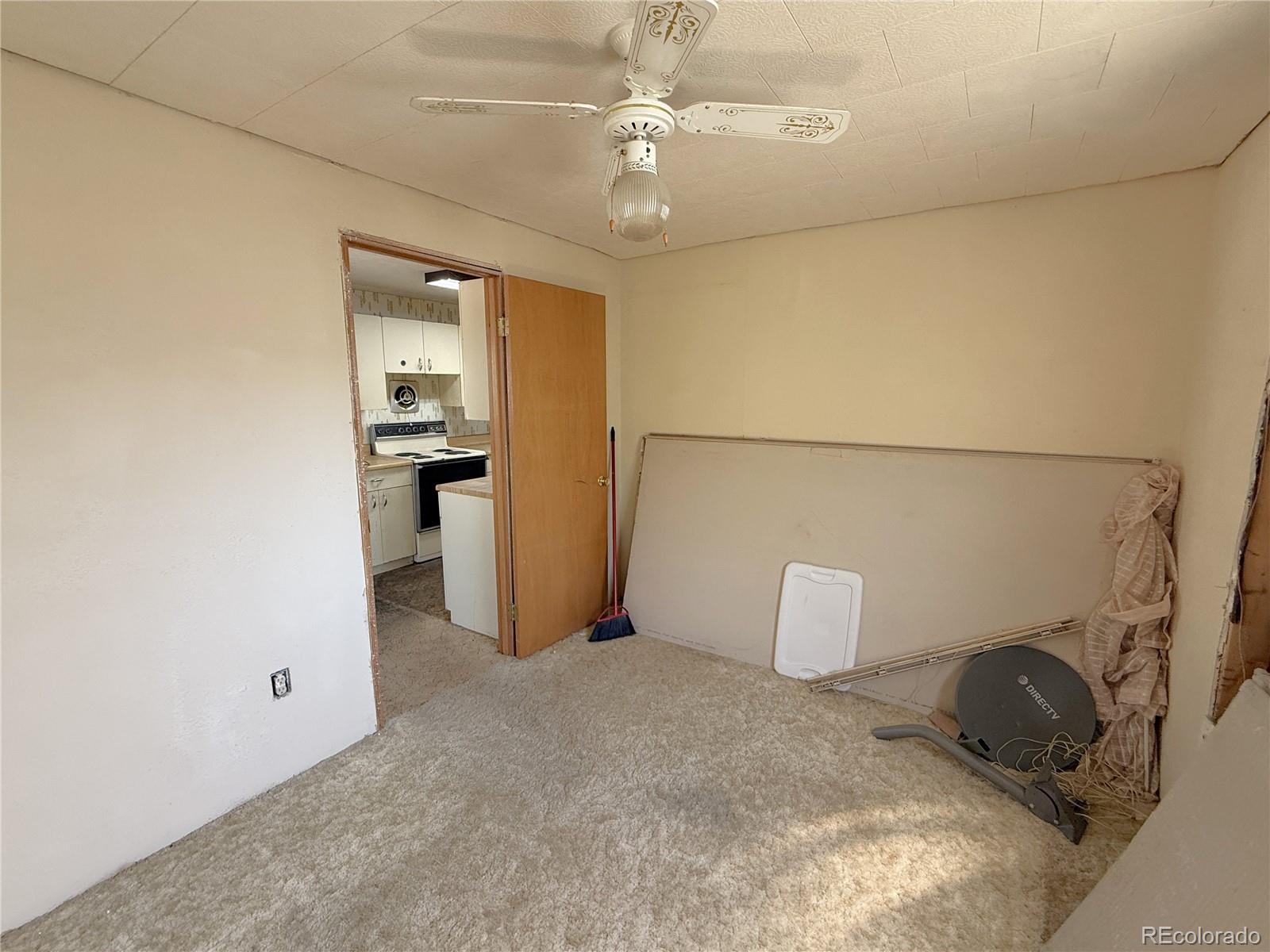 426 3rd Street Hugo, CO 80821 - Photo 11 of 34 a room with a bed and cabinets