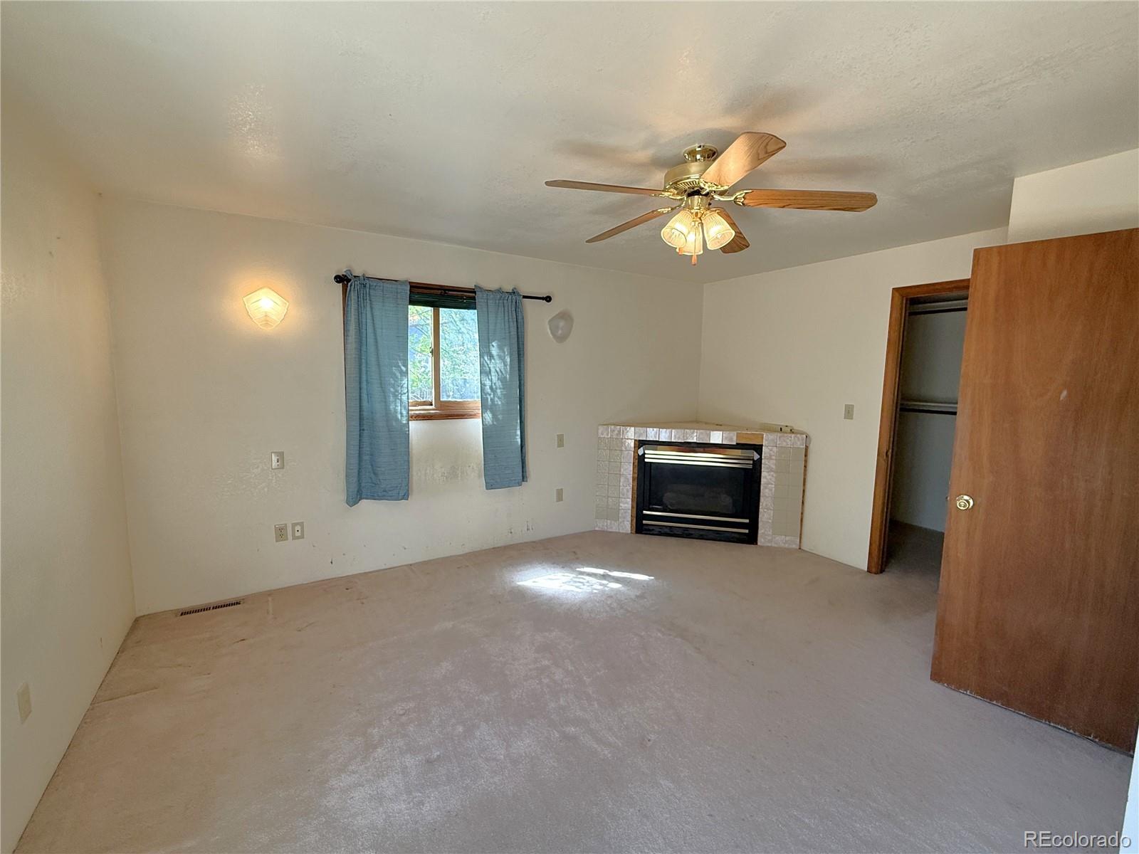 426 3rd Street Hugo, CO 80821 - Photo 16 of 34 a view of empty room with a ceiling fan and window