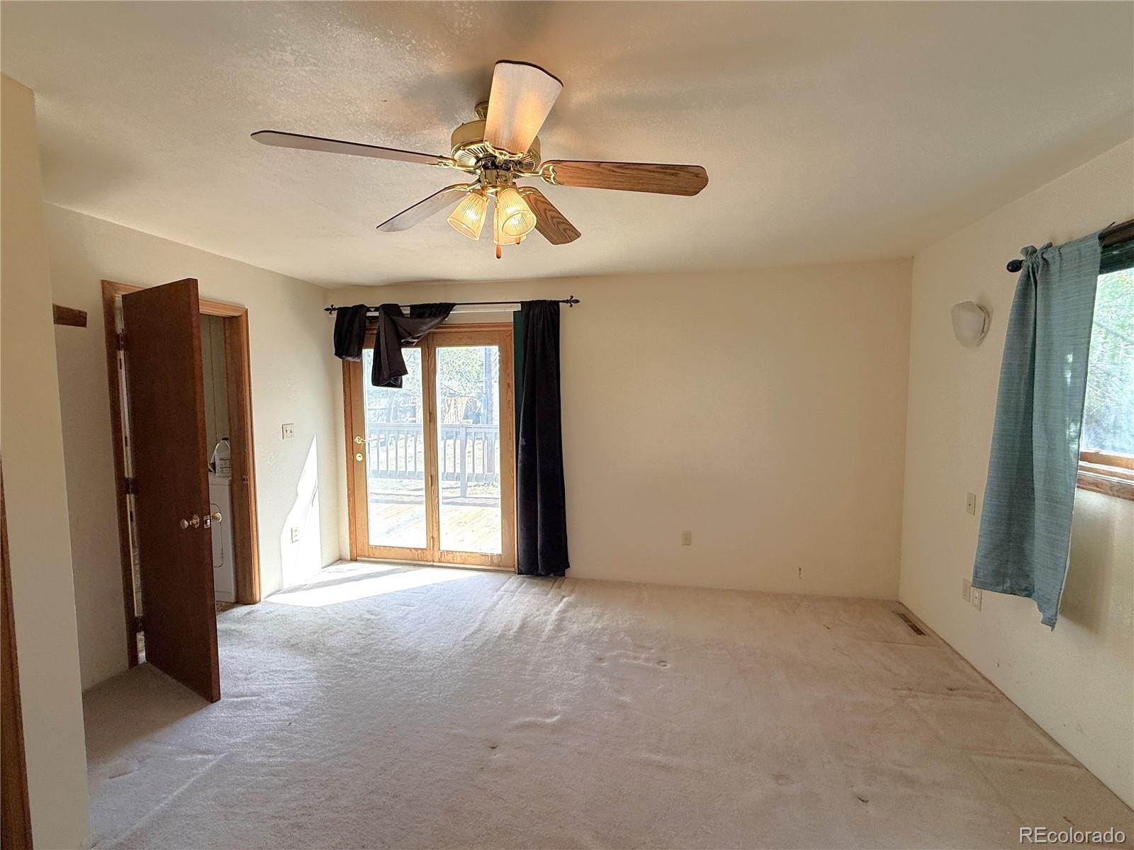 426 3rd Street Hugo, CO 80821 - Photo 18 of 34 an empty room with windows and fan