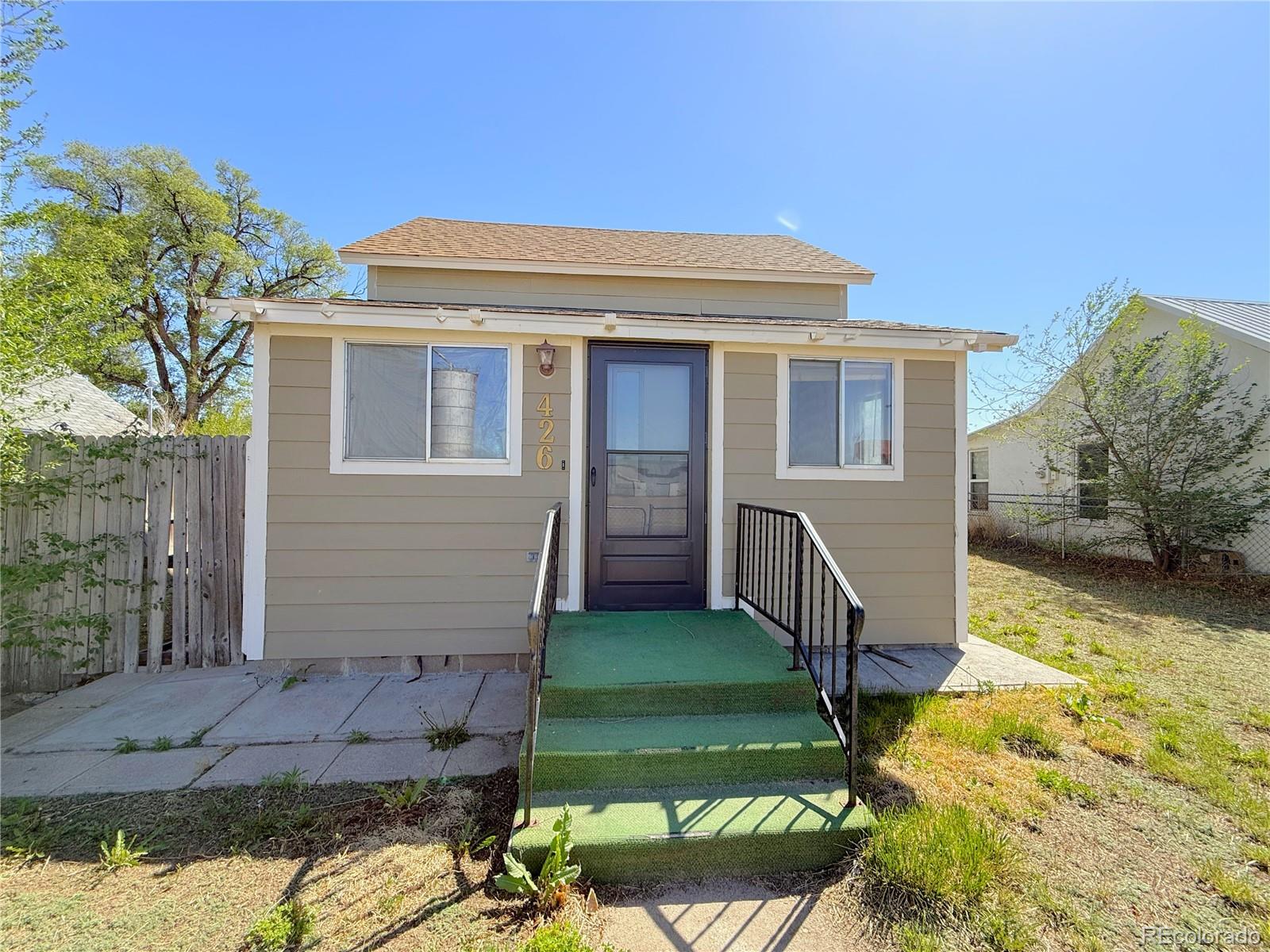 426 3rd Street Hugo, CO 80821 - Photo 2 of 34 a view of a house with a yard