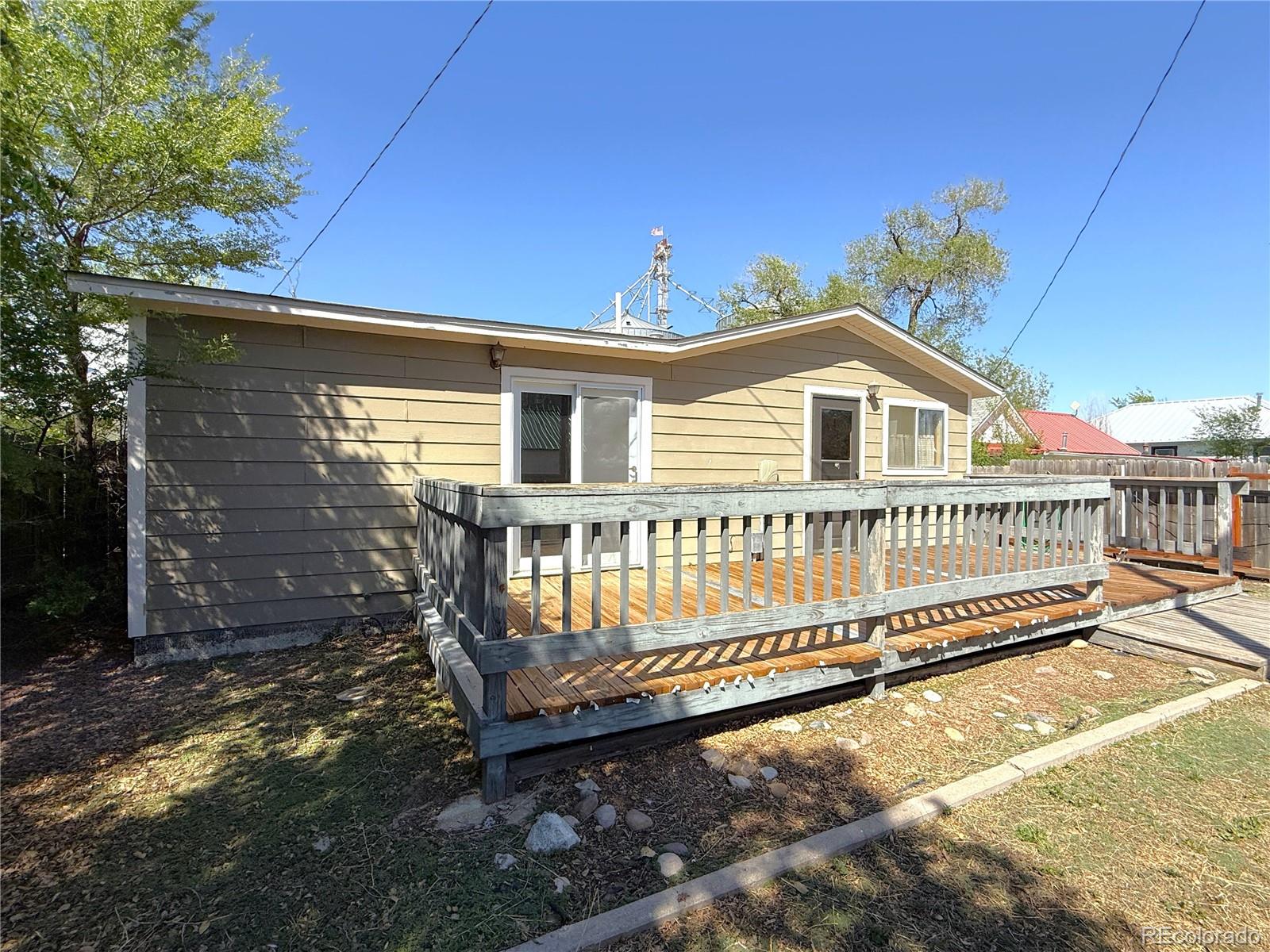 426 3rd Street Hugo, CO 80821 - Photo 22 of 34 a view of a house with a yard