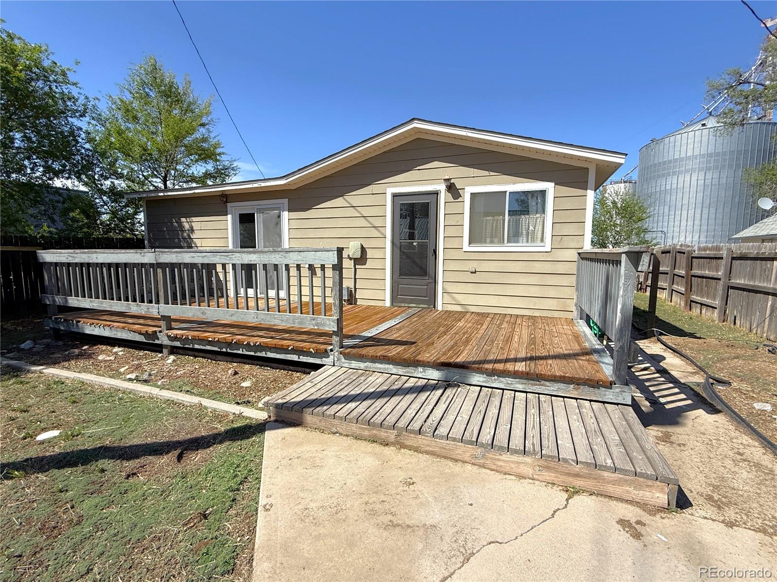 426 3rd Street Hugo, CO 80821 - Photo 23 of 34 a view of a house with wooden deck