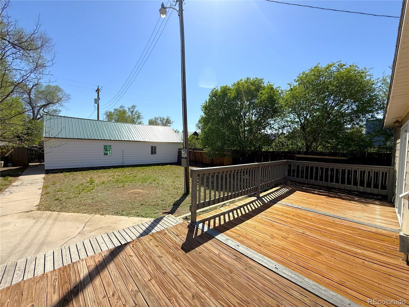 426 3rd Street Hugo, CO 80821 - Photo 25 of 34 a view of balcony with wooden floor and outdoor space