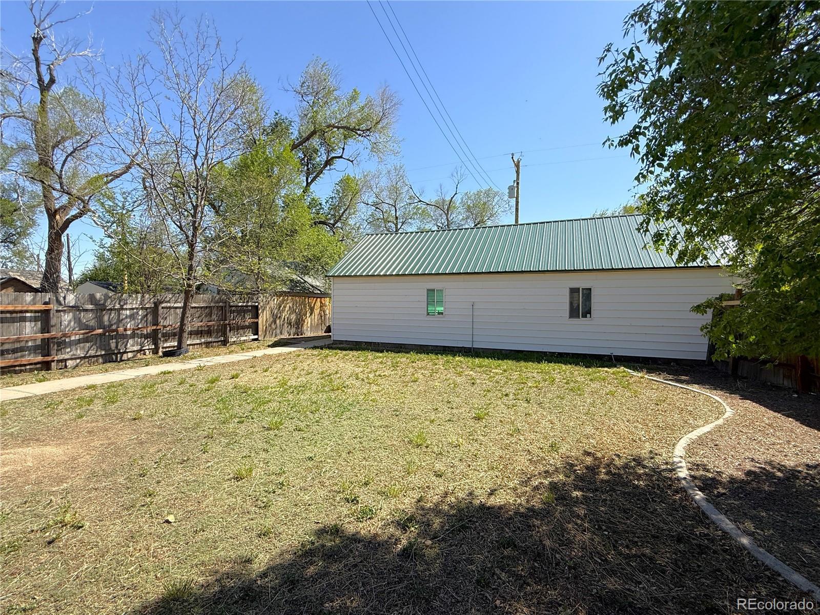 426 3rd Street Hugo, CO 80821 - Photo 27 of 34 a view of a house with a yard
