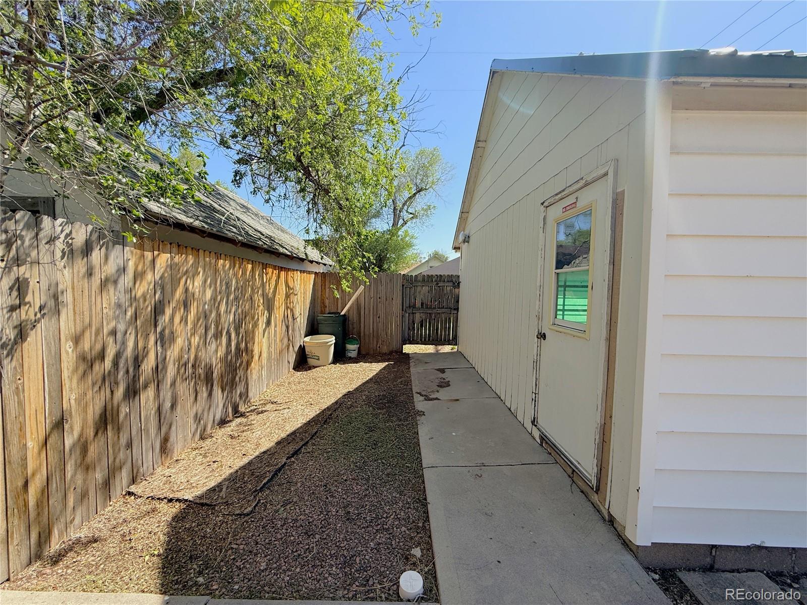 426 3rd Street Hugo, CO 80821 - Photo 29 of 34 a view of a house with a wooden fence