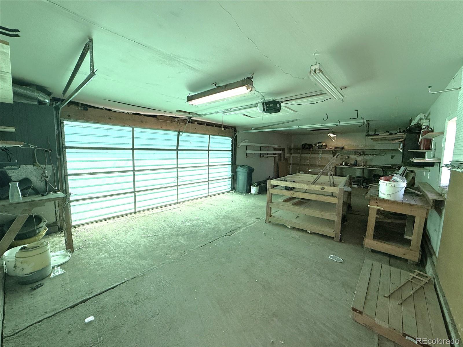 426 3rd Street Hugo, CO 80821 - Photo 30 of 34 a garage with a table and chairs