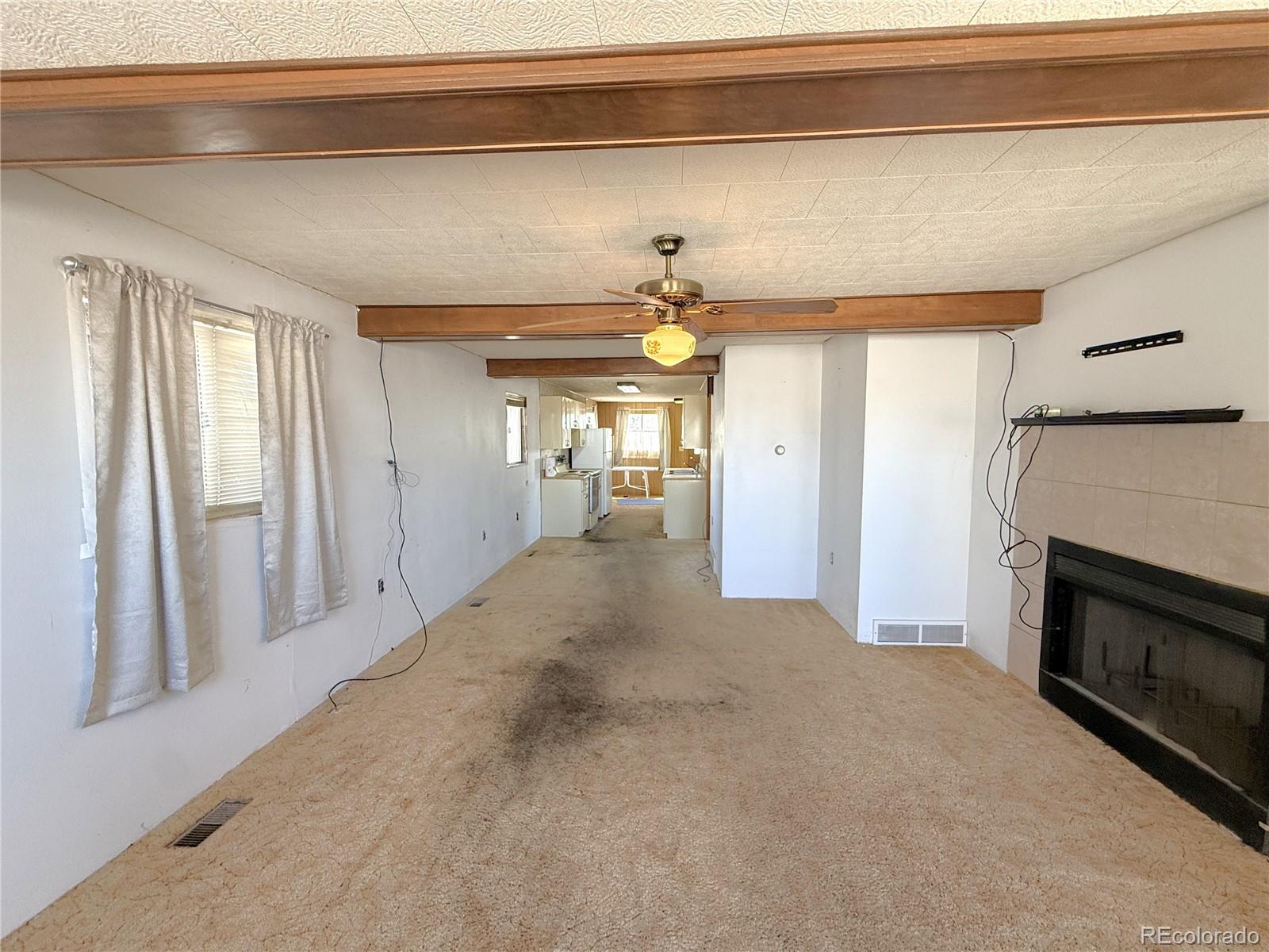 426 3rd Street Hugo, CO 80821 - Photo 3 of 34 a view of a hallway with an empty room
