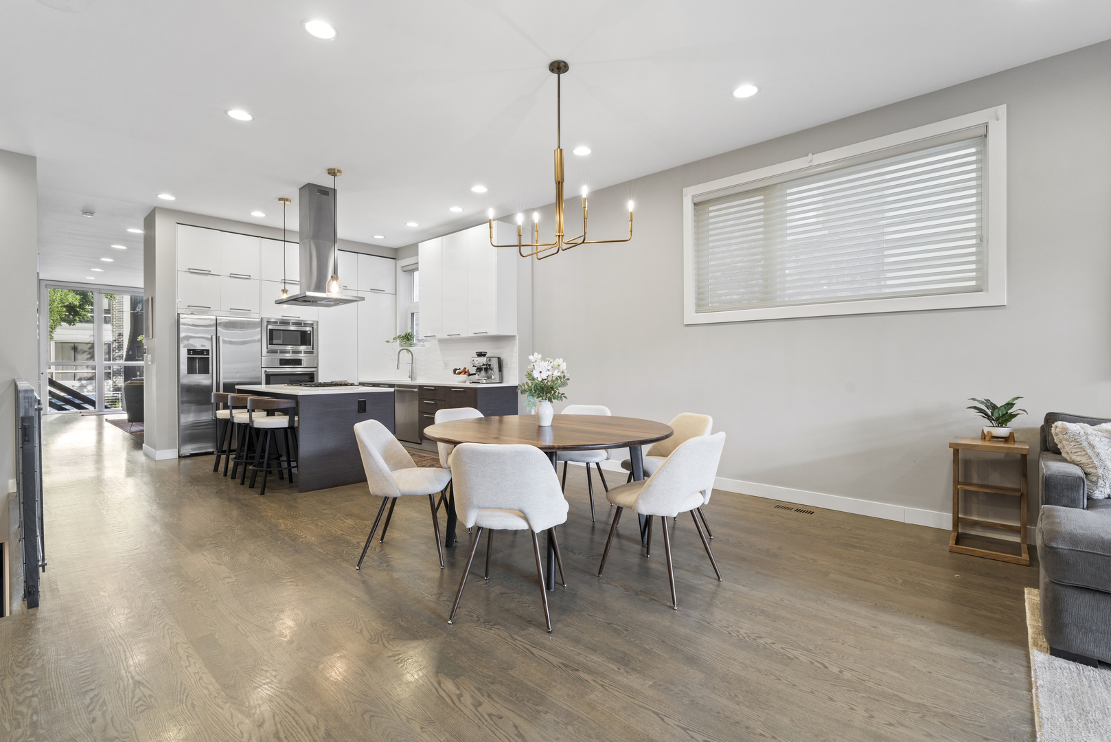 878 North Marshfield Avenue, Unit 1 Chicago, IL 60622 - Photo 11 of 26 a dining room with furniture a chandelier and kitchen view