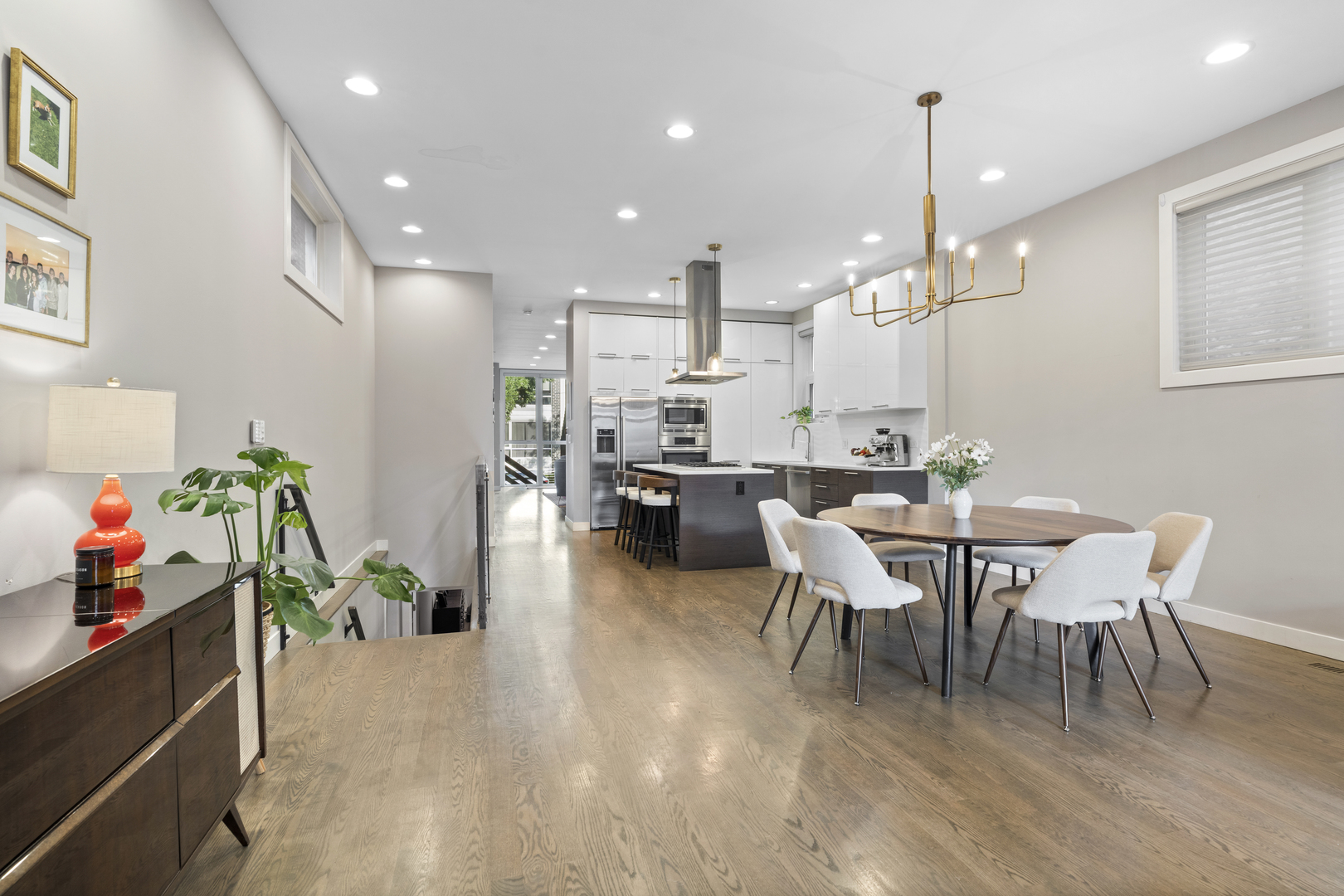 878 North Marshfield Avenue, Unit 1 Chicago, IL 60622 - Photo 12 of 26 a view of a dining room and livingroom with furniture wooden floor a chandelier