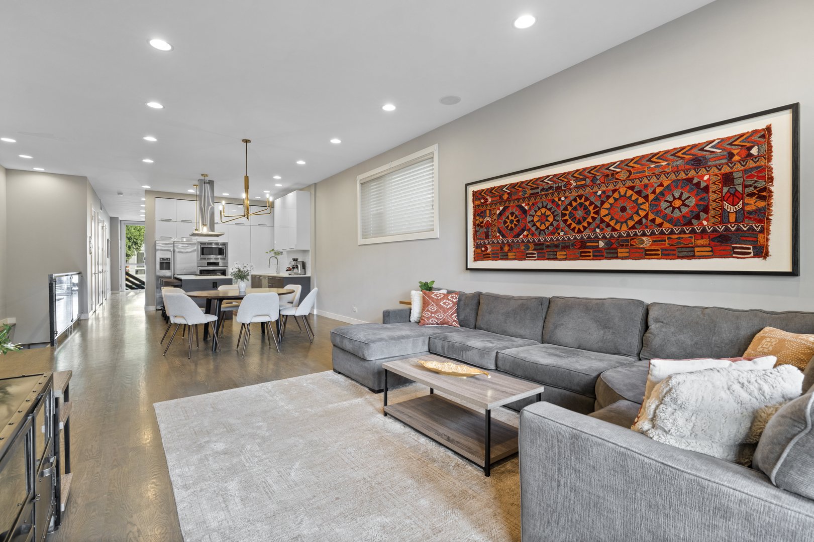 878 North Marshfield Avenue, Unit 1 Chicago, IL 60622 - Photo 15 of 26 a living room with furniture and kitchen view