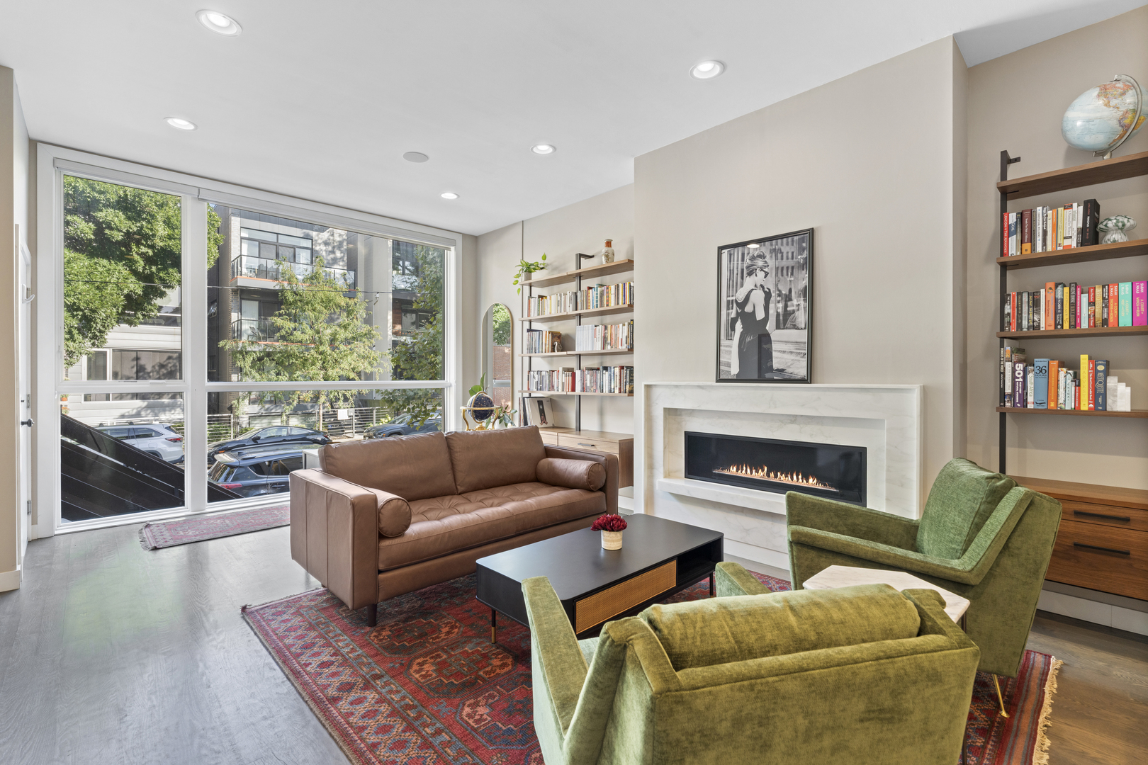 878 North Marshfield Avenue, Unit 1 Chicago, IL 60622 - Photo 5 of 26 a living room with furniture fireplace and a large window