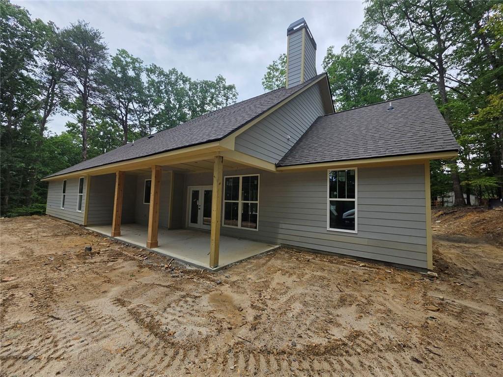 86 Turkey Trail Jasper, GA 30143 - Photo 4 of 13 a house with trees in the background