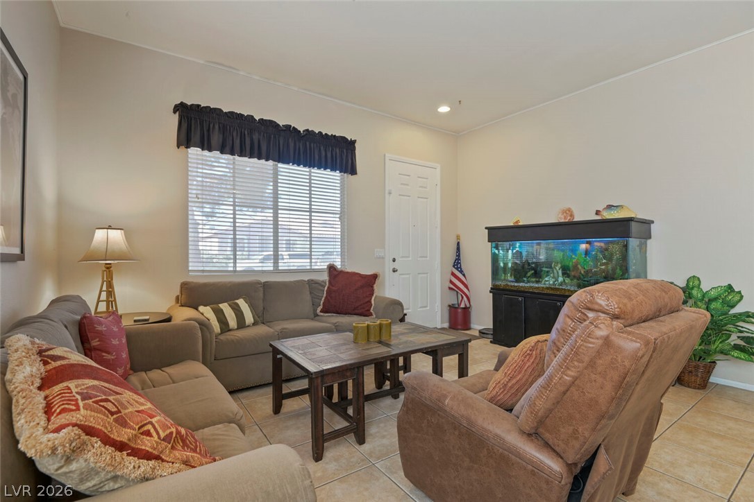 2356 Tilden Way Henderson, NV 89074 - Photo 5 of 30 An inviting living room, perfect for relaxation, features durable tile flooring and a well-lit ambiance.