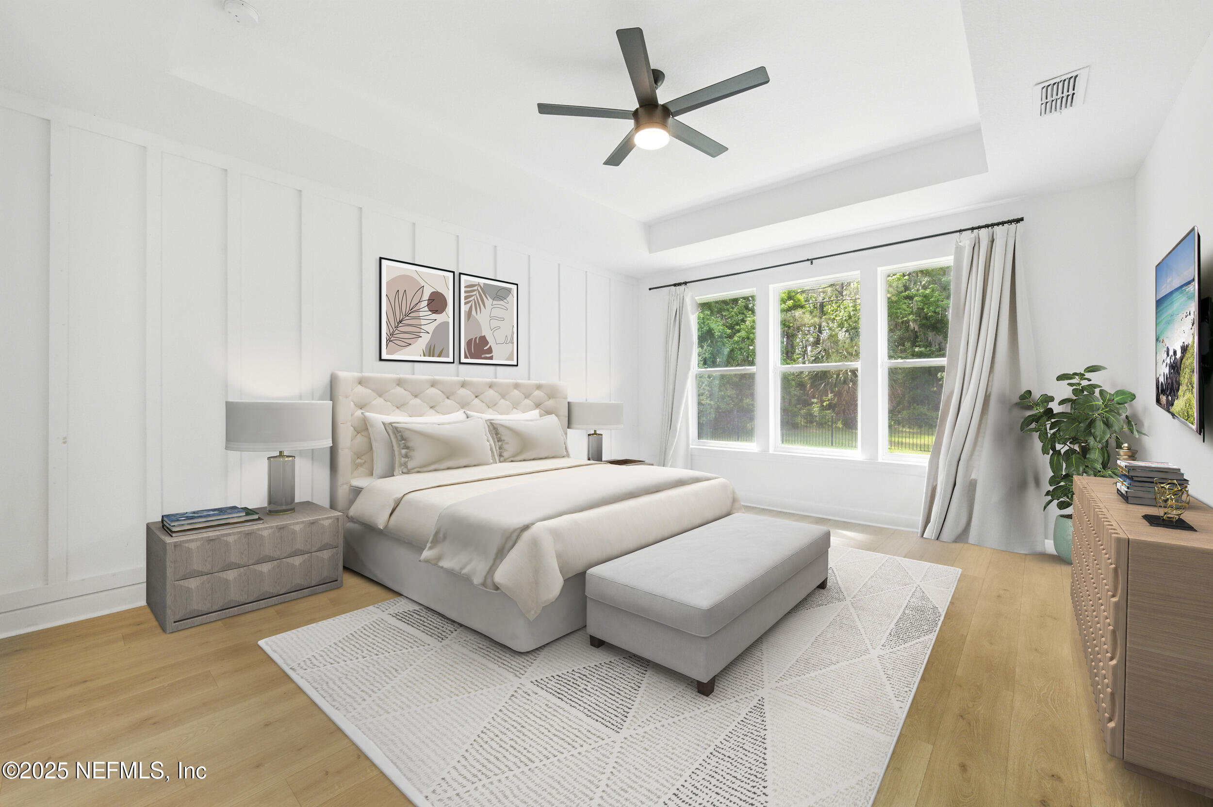 177 Windwalker Drive St. Augustine, FL 32092 - Photo 18 of 30 a bedroom with a large bed couch and a large window