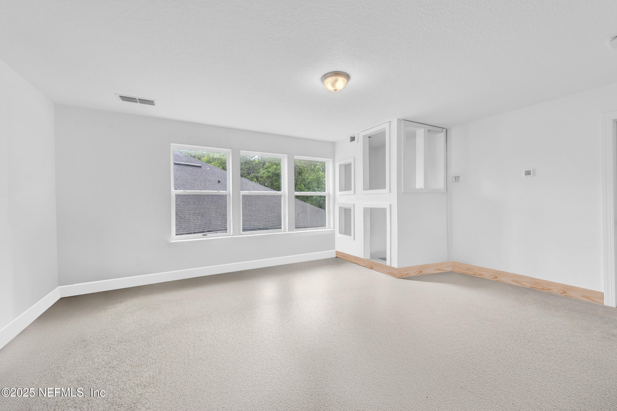 177 Windwalker Drive St. Augustine, FL 32092 - Photo 21 of 30 an empty room with windows