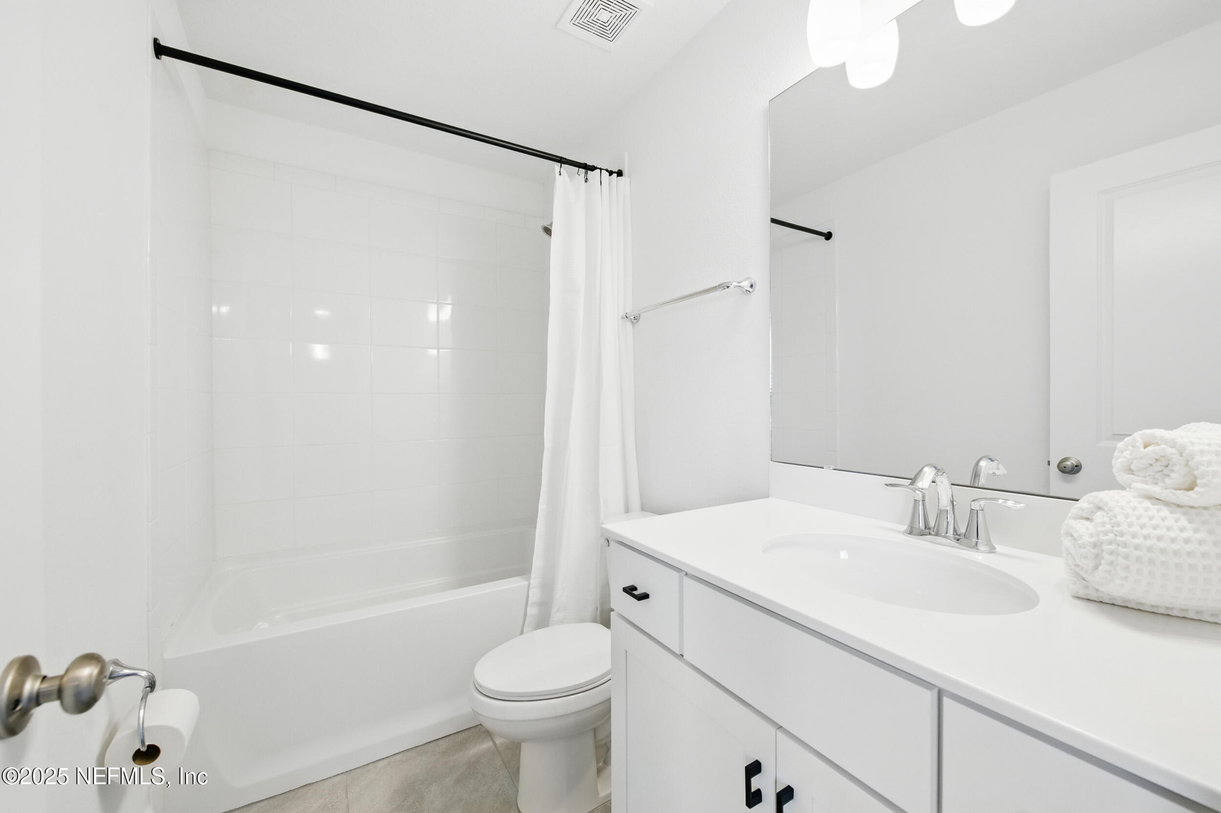 177 Windwalker Drive St. Augustine, FL 32092 - Photo 24 of 30 a bathroom with a sink toilet and shower