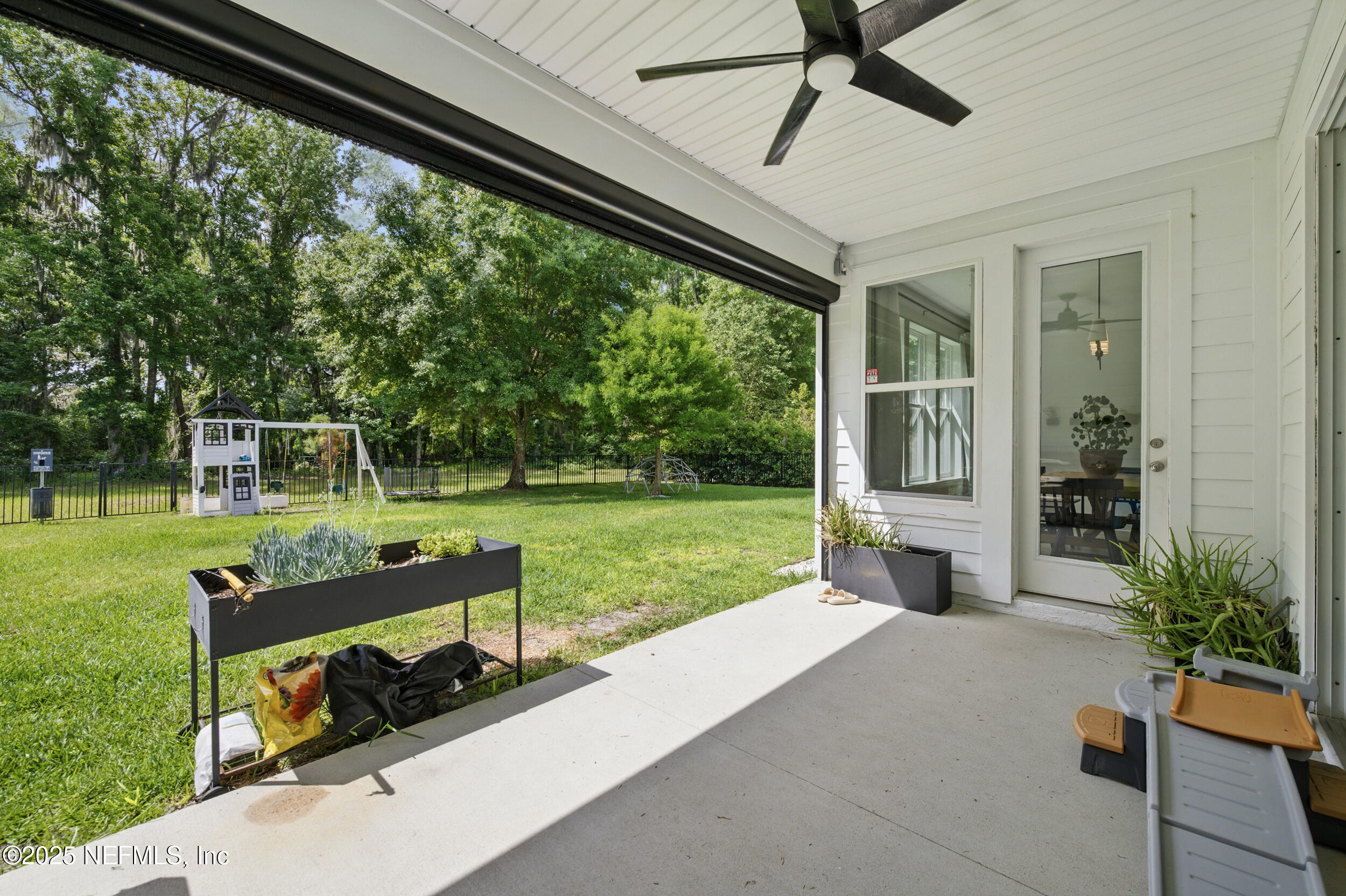 177 Windwalker Drive St. Augustine, FL 32092 - Photo 26 of 30 a front view of a house with garden