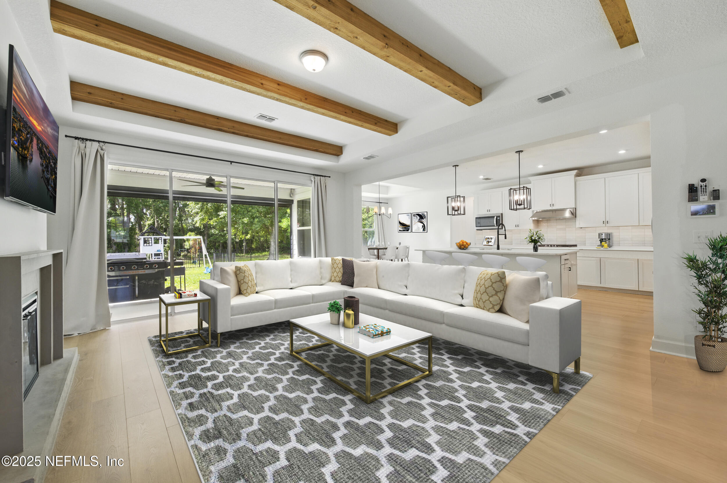 177 Windwalker Drive St. Augustine, FL 32092 - Photo 7 of 30 a living room with furniture and a large window