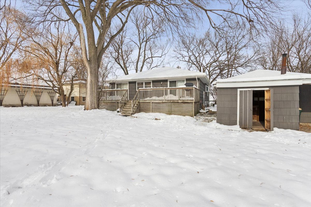 11333 72nd Street Burr Ridge, IL 60527 - Photo 21 of 32 a view of a house with a yard covered in snow