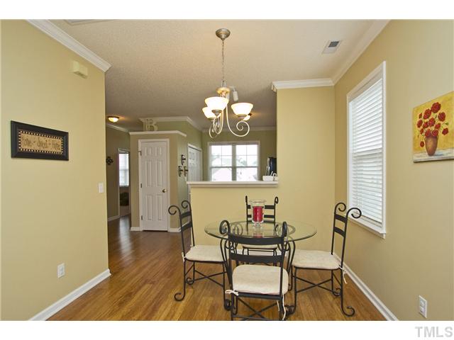 1023 Dual Parks Road Apex, NC 27502 - Photo 5 of 16 Dining Area with chandelier is open to the kitchen and family room.