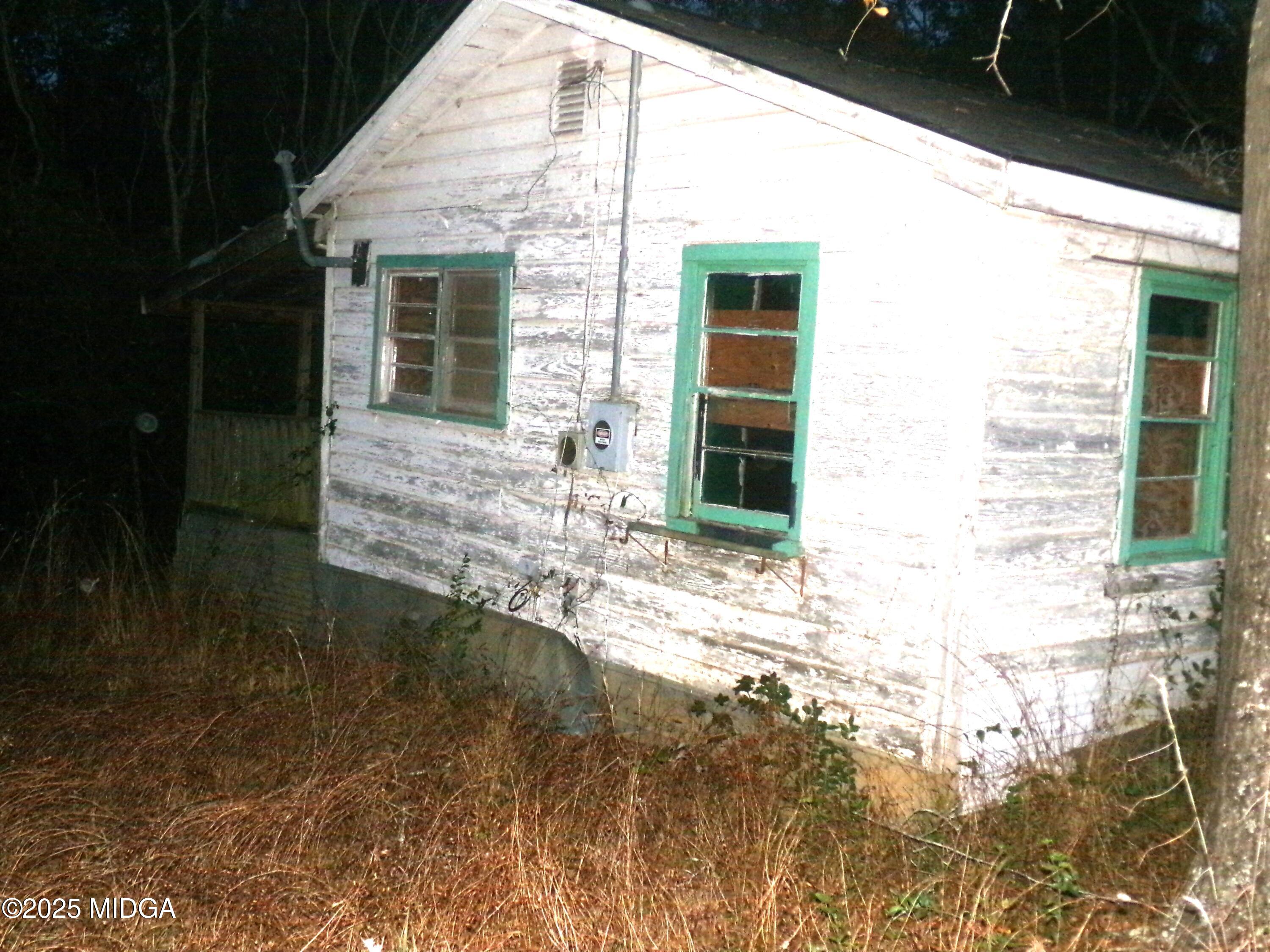 58 Strawberry Road Dry Branch, GA 31020 - Photo 3 of 10 a view of house with backyard