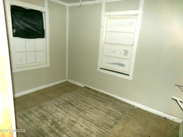 a view of backyard with tub