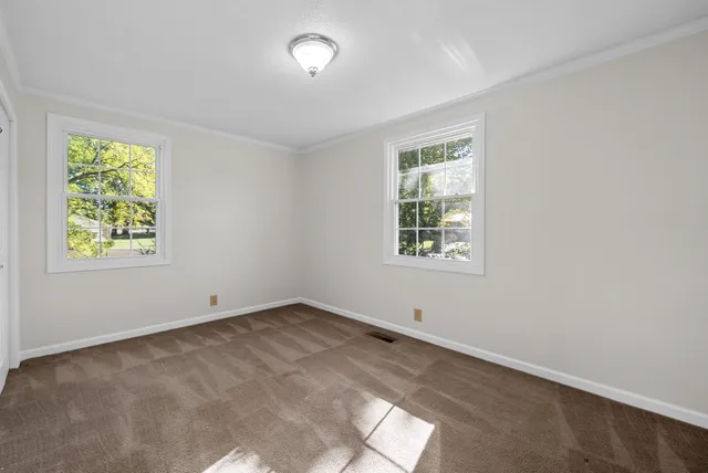 an empty room with windows