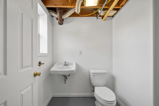 a view of a house with a backyard and a patio