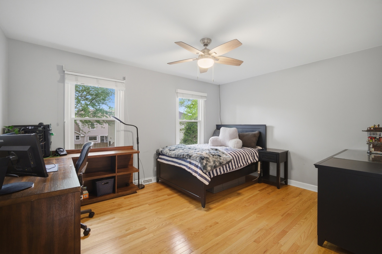 2831 Farmington Road Northbrook, IL 60062 - Photo 24 of 33 a bedroom with a bed and a chandelier