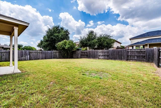 a swimming pool with wooden fence