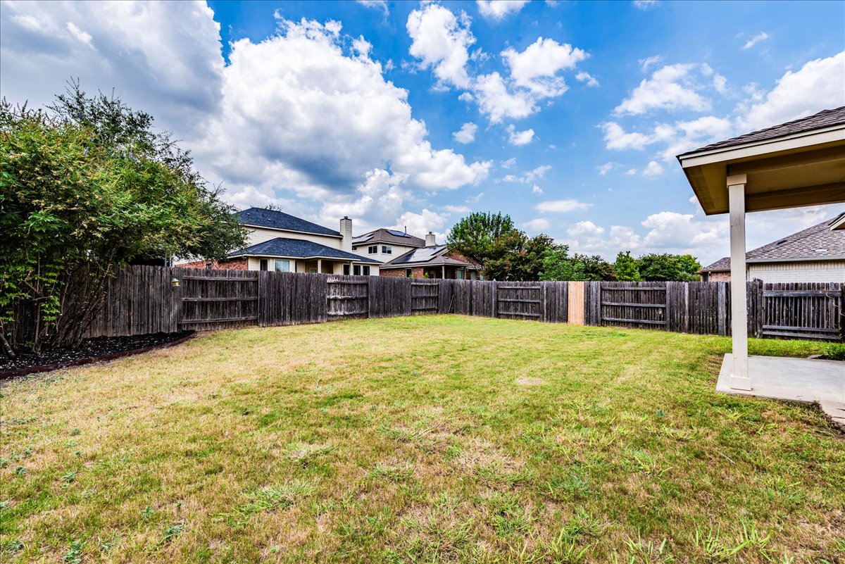 18628 Wind Valley Way Pflugerville, TX 78660 - Photo 25 of 33 a view of a swimming pool with a yard