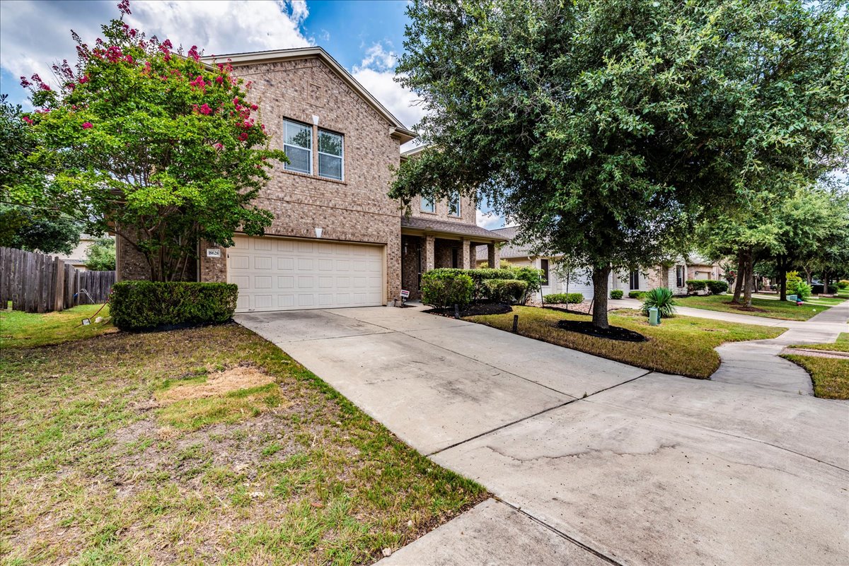18628 Wind Valley Way Pflugerville, TX 78660 - Photo 3 of 33 a house with palm tree in front of it