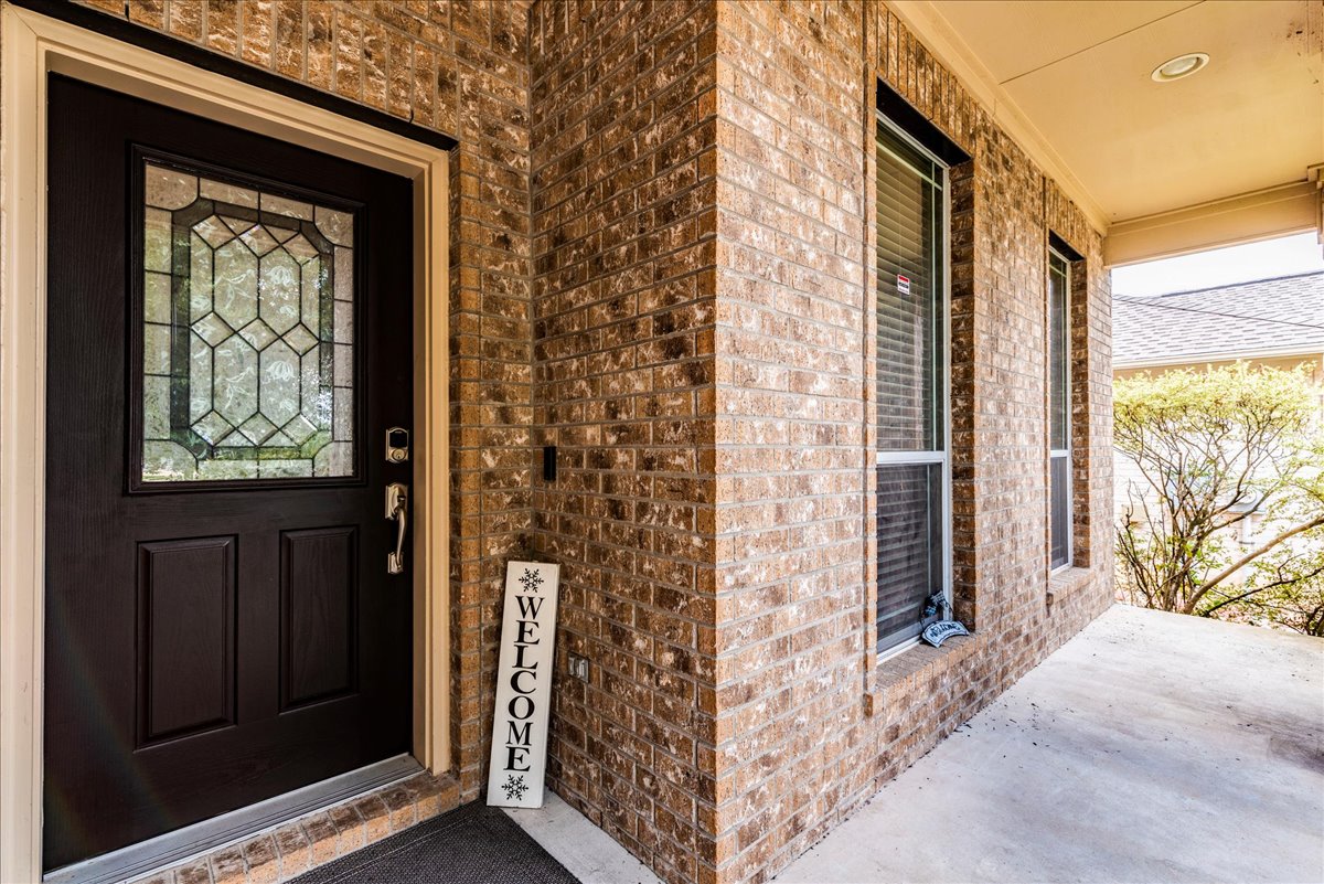 18628 Wind Valley Way Pflugerville, TX 78660 - Photo 5 of 33 a door view with a outdoor space