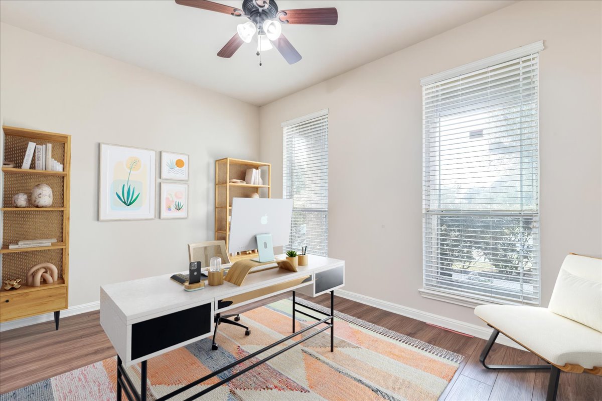 18628 Wind Valley Way Pflugerville, TX 78660 - Photo 6 of 33 a view of a workspace with furniture and a window