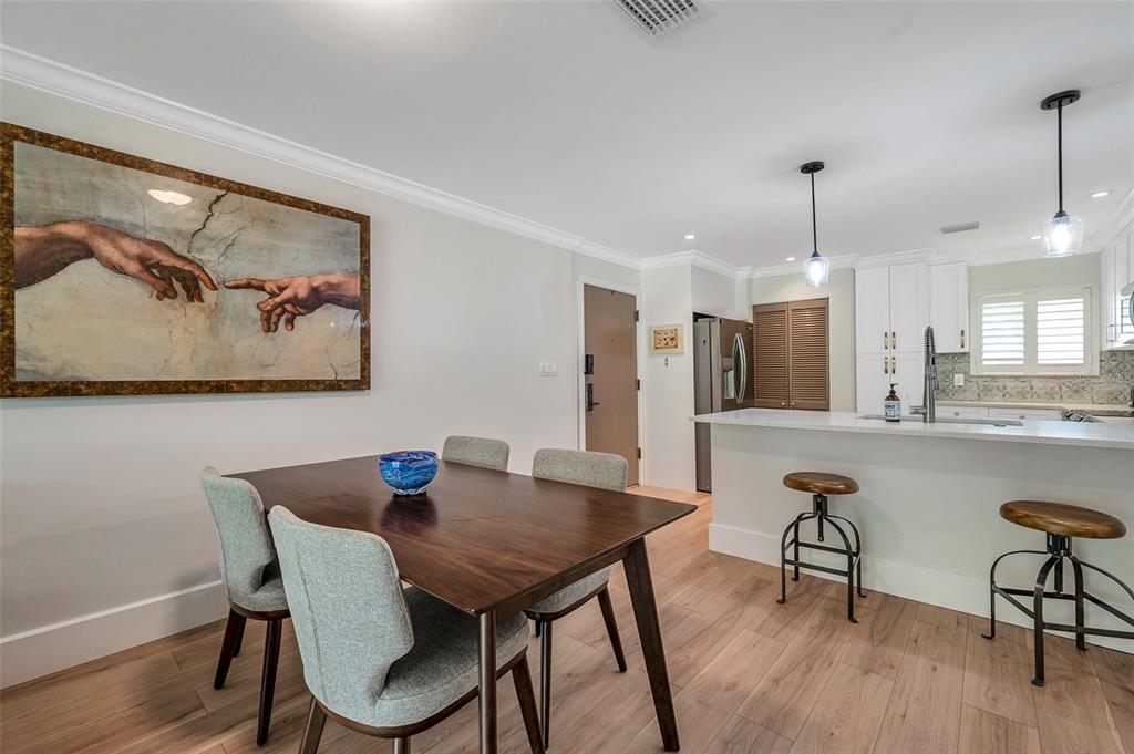 29147 Bay Hollow Drive, Unit 3224 Wesley Chapel, FL 33543 - Photo 18 of 89 a view of a dining room with furniture window and wooden floor