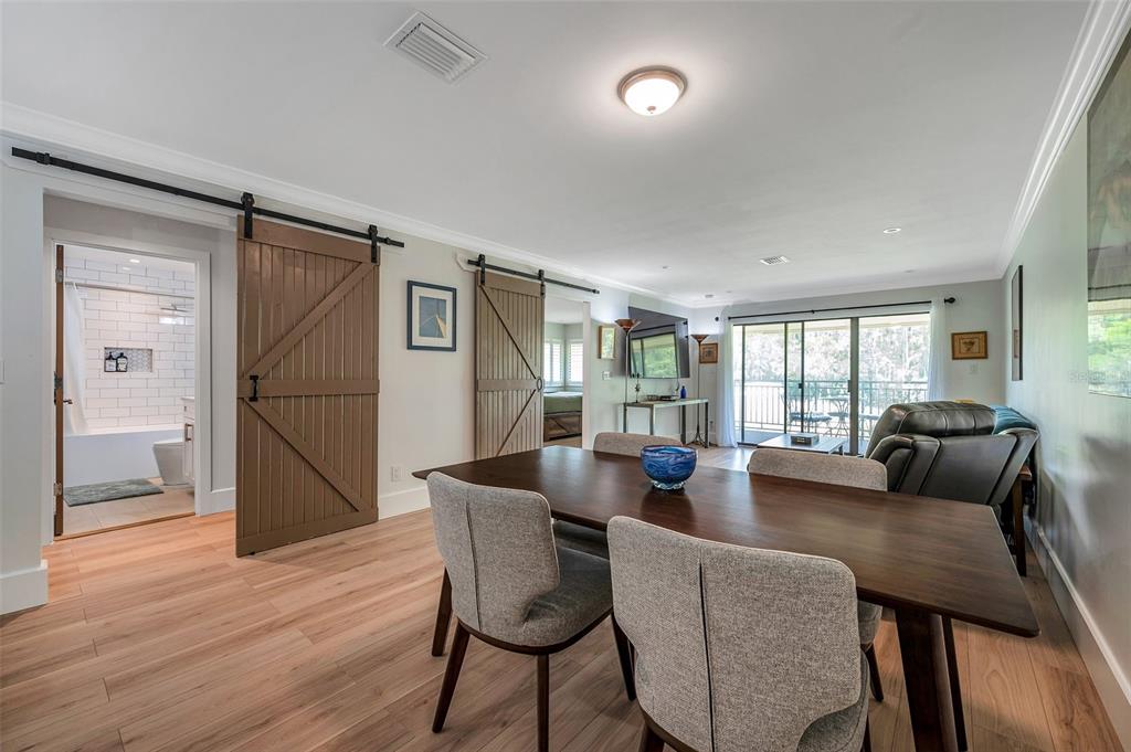 29147 Bay Hollow Drive, Unit 3224 Wesley Chapel, FL 33543 - Photo 19 of 89 a dining room with furniture and wooden floor