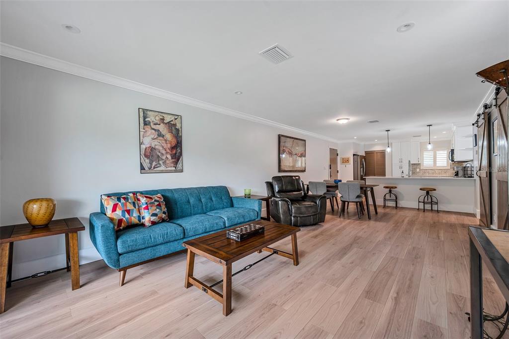 29147 Bay Hollow Drive, Unit 3224 Wesley Chapel, FL 33543 - Photo 22 of 89 a living room with furniture and wooden floor