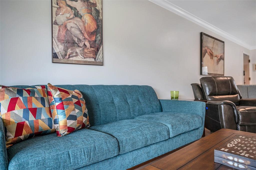 29147 Bay Hollow Drive, Unit 3224 Wesley Chapel, FL 33543 - Photo 24 of 89 a living room with furniture and painting on the wall