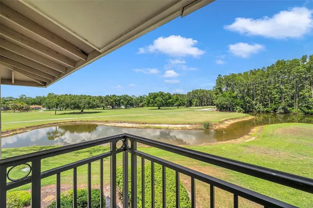 a bedroom with bed and wooden floor