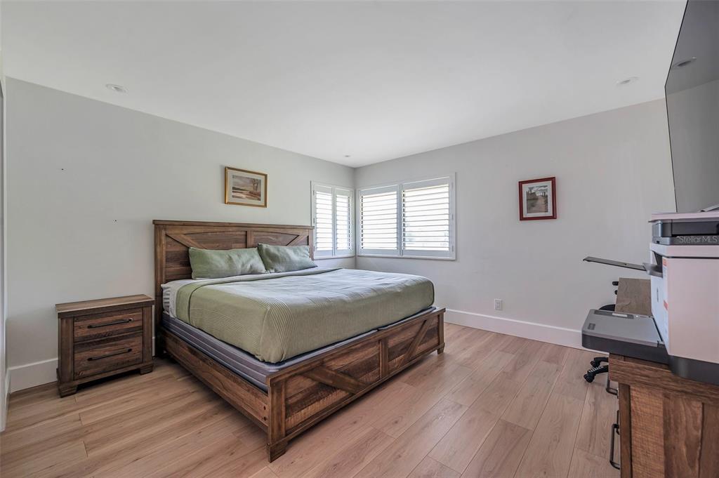 29147 Bay Hollow Drive, Unit 3224 Wesley Chapel, FL 33543 - Photo 31 of 89 a bedroom with a bed and a tv on table