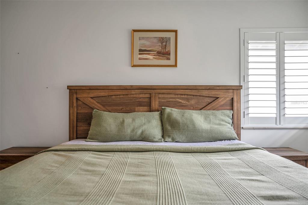 29147 Bay Hollow Drive, Unit 3224 Wesley Chapel, FL 33543 - Photo 35 of 89 a bed sitting in a bedroom next to a window