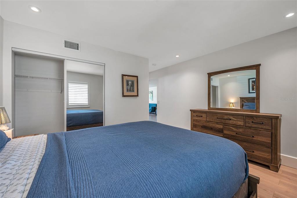 29147 Bay Hollow Drive, Unit 3224 Wesley Chapel, FL 33543 - Photo 42 of 89 a bedroom with a bed and a dresser