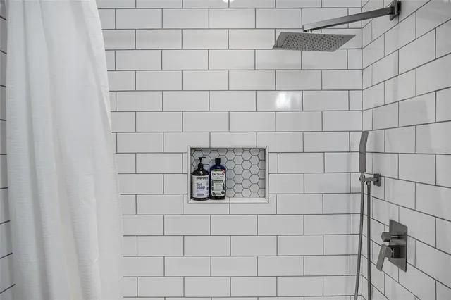 an aerial view of residential houses with outdoor space swimming pool and ocean view