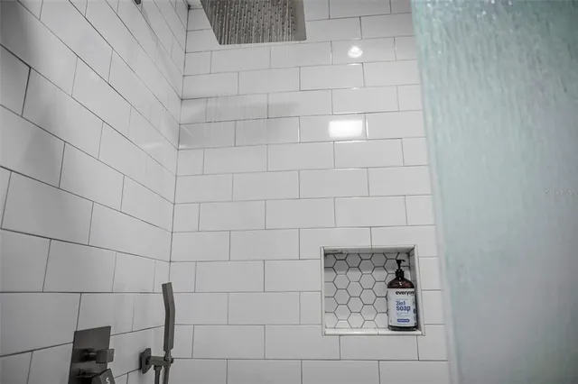 an aerial view of residential houses with outdoor space and river