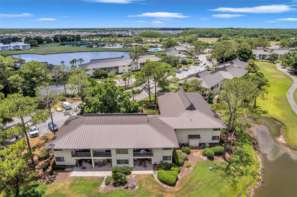 29147 Bay Hollow Drive, Unit 3224 Wesley Chapel, FL 33543 - Photo 63 of 89 an aerial view of a house with a swimming pool outdoor seating and yard