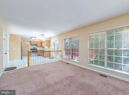 a view of a big room with windows