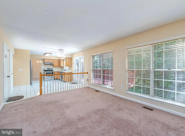 a view of a big room with windows